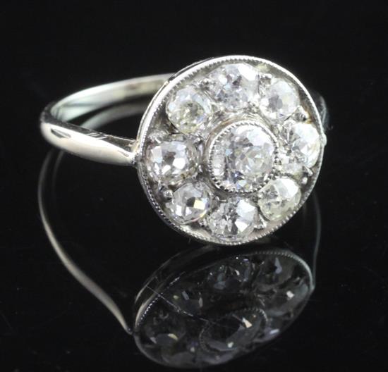 A white gold and diamond cluster target ring, size K.